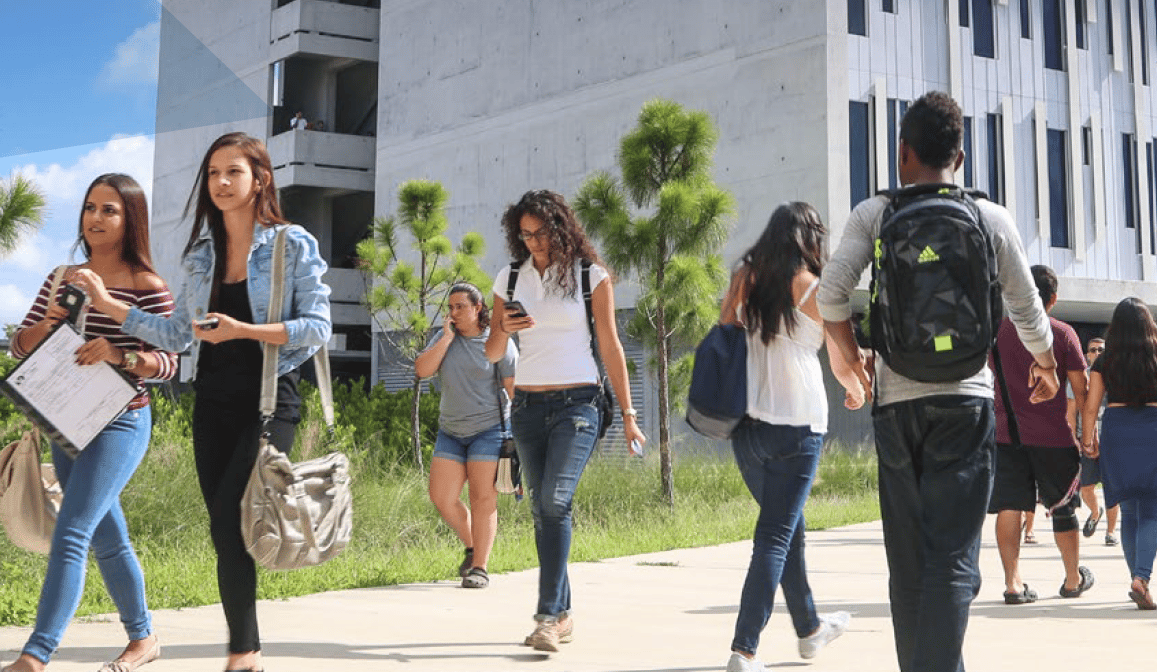 Students walk outdoors on the Miami Dade College campus